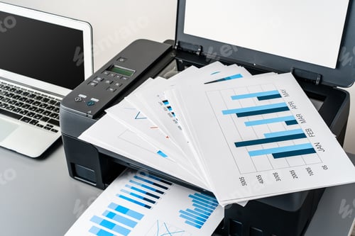 Preview: Printer and laptop on grey table in office