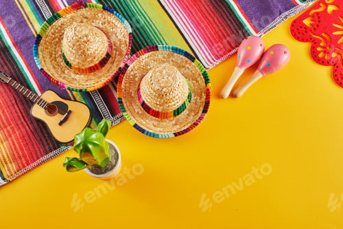 Preview: Cinco de Mayo holiday background. Maracas, cactus and hat on yellow background.