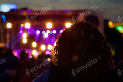 Preview: Blurred Crowd Enjoying Concert Under Stage Lights