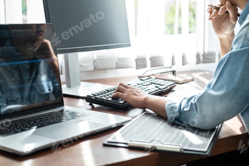 Preview: Close up of hand asian woman programmer typing code data about new project with keyboard on laptop