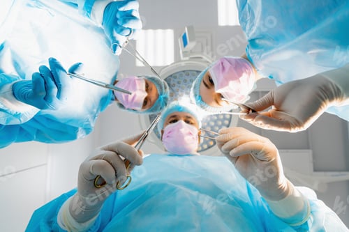 Preview: doctors surgeons and nurses holding scalpels surgical instruments during operation in hospital