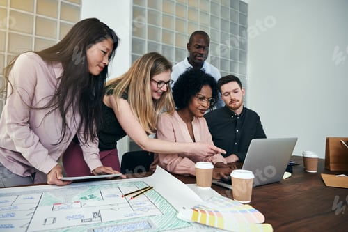 Preview: Diverse group of designers working together in an office