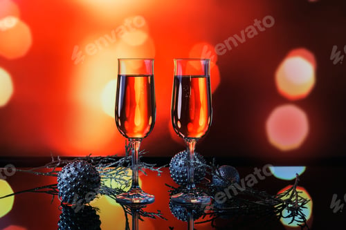 Preview: Two glasses of rose champagne and Christmas or New Year decoration