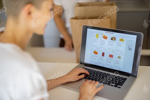 Preview: Woman choosing groceries online and man with bags