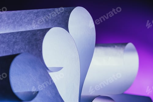 Preview: close up view of white paper curves on each other on dark purple