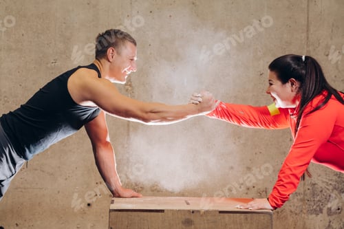 Preview: funny positive obese woman ahd sporty man handshaking