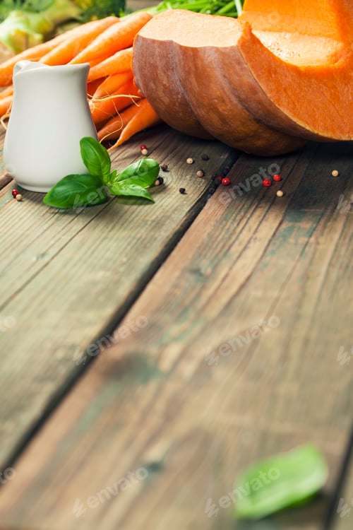 Preview: Vegetable or pumpkin soup and ingredients. Warm and comfy autumn concept.