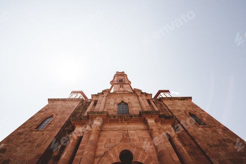 Preview: Low angle shot of a cathedral church with a blue sky in the background in Zacatecas Mexico