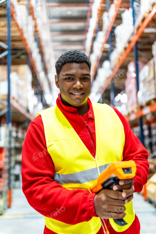 Preview: Warehouse worker holding modern scan to check packages