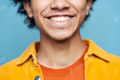 Preview: African American man with toothy smile isolated on blue background. Health care, dental treatment