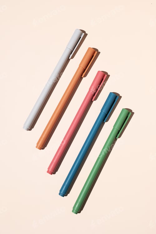 Preview: Some colourful pen arranging on beige.