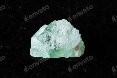 Preview: sample of raw herderite mineral on black granite