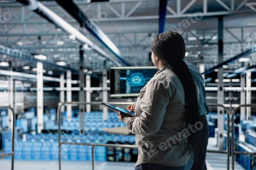 Preview: Data center software developer using using laptop to upgrade AI workloads