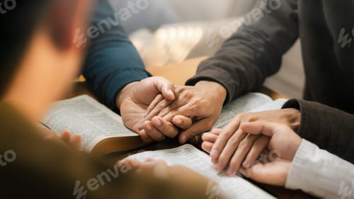Preview: Group of young Christians praying, holding hands and praying together The concept of praying to God
