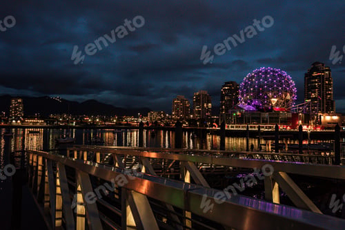 Preview: Beautiful cityscape captured during the night under the cloudy sky