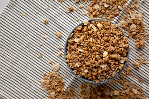 Preview: Healthy Homemade Toasted Muesli with Nuts in a Bowl, top view. Copy space.