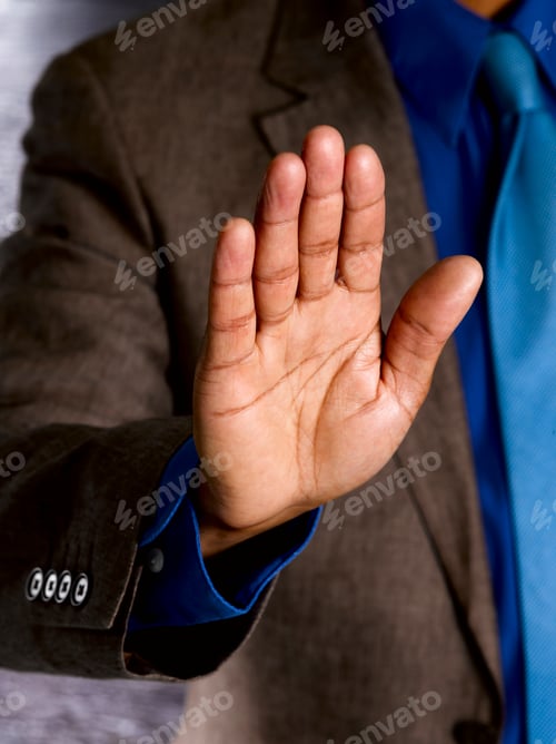 Preview: Business man with palm to camera