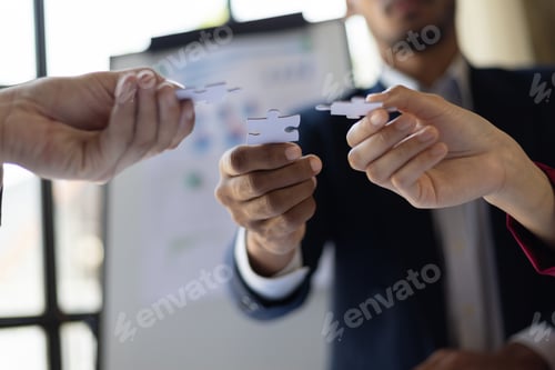 Preview: People holding puzzles to connect, Teamwork of people in the organization. Jigsaw