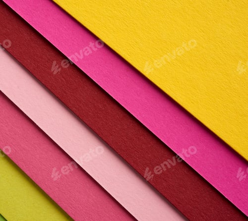 Preview: Multi-colored cardboard folded in layers with a shadow, abstract creative backdrop