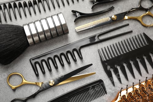 Preview: Different hairdresser's tools on grey table, flat lay