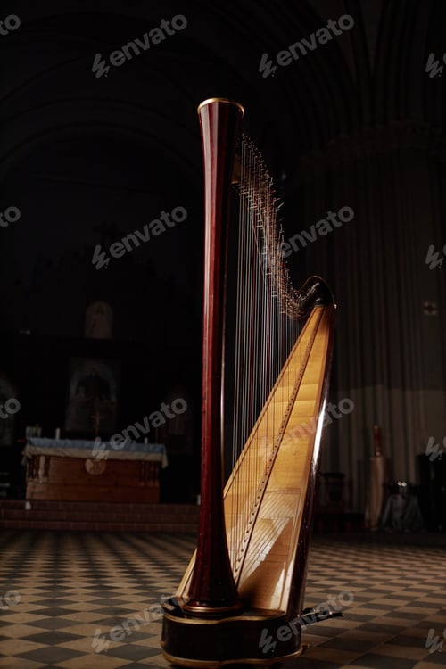 Preview: Antique Harp Standing in Dim Light Captured Church