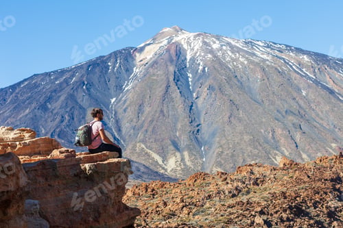 Preview: Traveler man on the edge of rock enjoy volcano El Teide