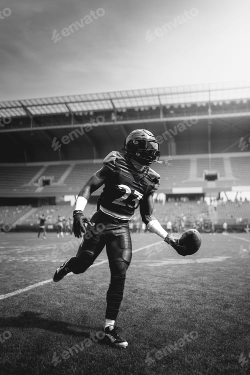 Preview: Football player in action on the field.