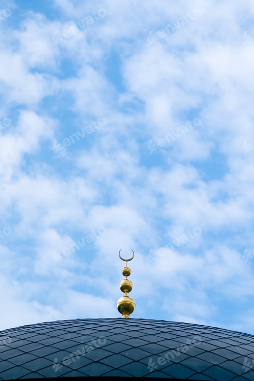 Preview: Close-up shot of the gambiz dome with a crescent moon on top of a Muslim mosque against a blue sky