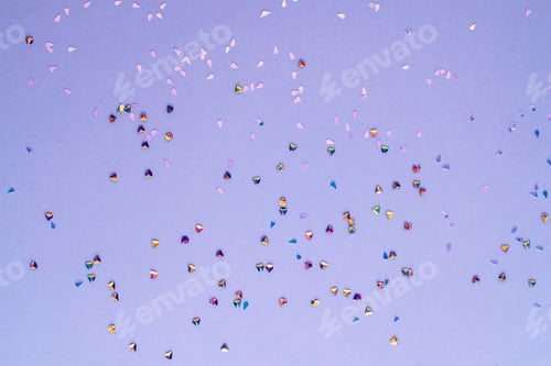 Preview: Golden confetti on purple background. Winter holidays, Christmas or birthday concept