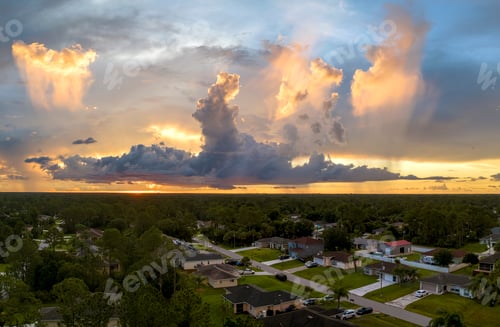 Preview: Aerial landscape view of suburban private houses between green palm trees in Florida