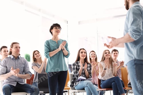 Preview: Male business trainer giving lecture in office