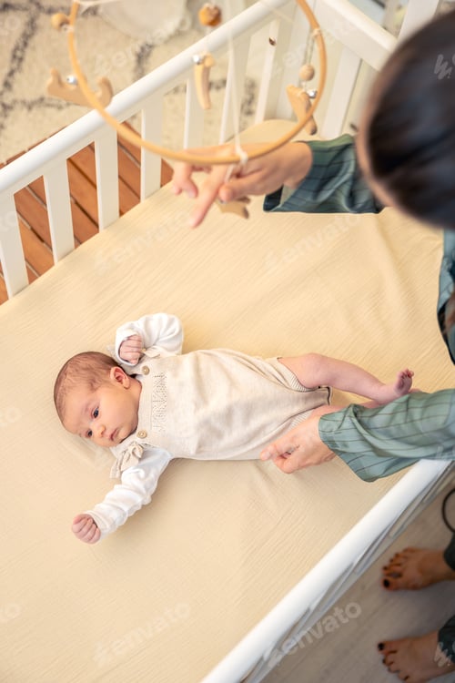 Preview: A young mother with a newborn baby. Newborn baby.