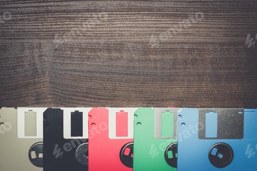Preview: retro technology concept diskette on wooden background