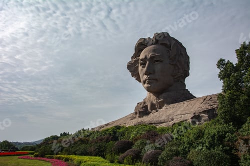 Preview: View of the Young Mao Zedong statue located on Orange Isle, with greenery in the foreground