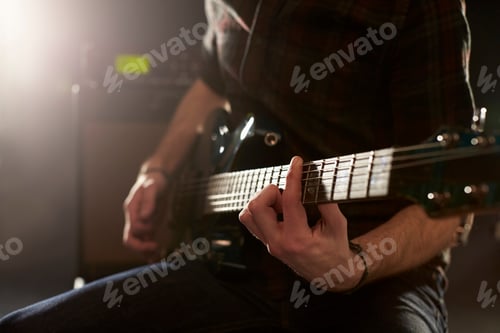 Preview: Close Up Of Man Playing Electric Guitar In Studio