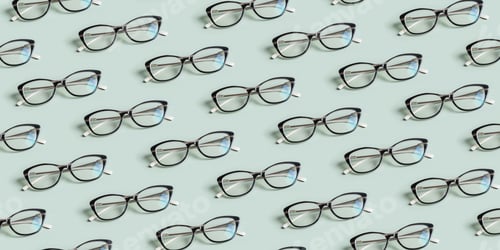 Preview: Eyes glasses pattern on green background. Optical store, vision test concept