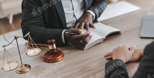 Preview: Business team and lawyers discussing contract papers sitting at the table. Concepts of law, advice