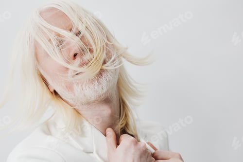 Preview: Portrait of a stylish man with long white hair, dressed in a trendy outfit, exuding confidence