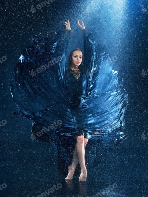 Preview: The young beautiful modern dancer dancing under water drops
