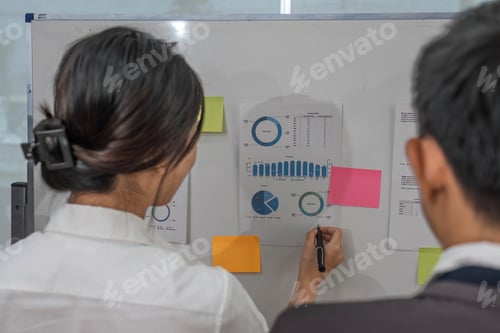 Preview: Casual creative happy two smile asian business people plan strategy analysis and brainstorm putting