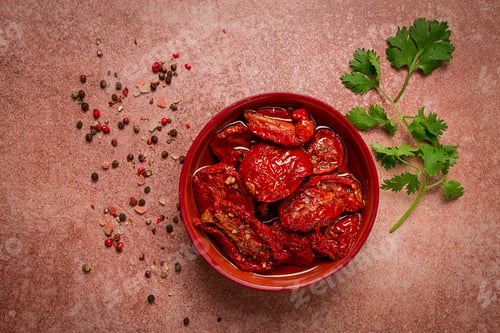Preview: dried tomatoes, in a bowl, top view, on a brown background,