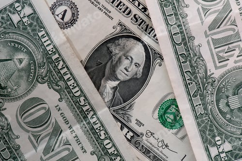 Preview: American cash. American one dollar banknotes close-up.