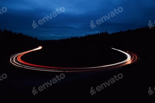 Preview: Long exposure of cars on a winding road