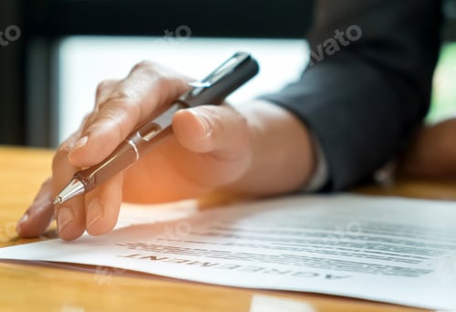 Preview: Businessmen holding pens in hand reading documents on the desk,B