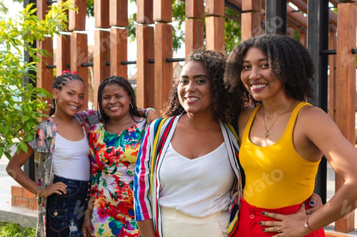 Preview: Joyful embrace between black women in the park