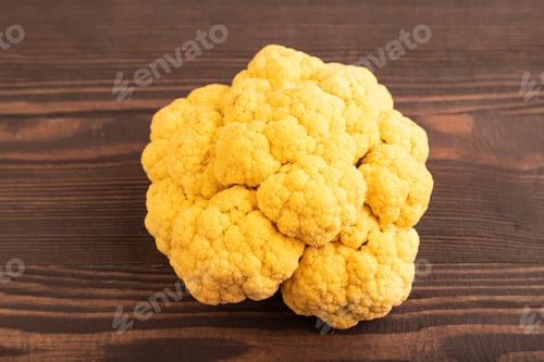 Preview: Yellow Cauliflower on brown wooden, Side view, close up