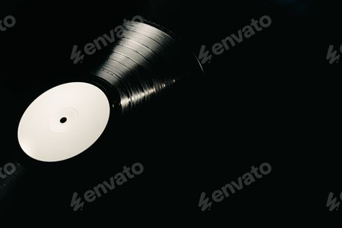 Preview: Vinyl record on black background illuminated, copy space