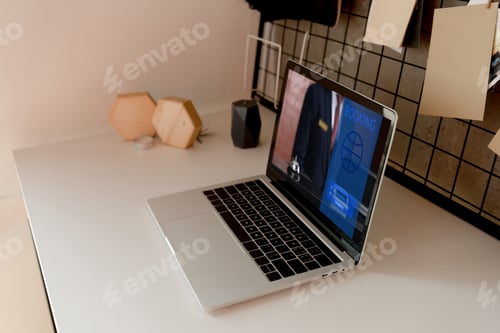 Preview: close up view of digital laptop with booking lettering on tabletop at home