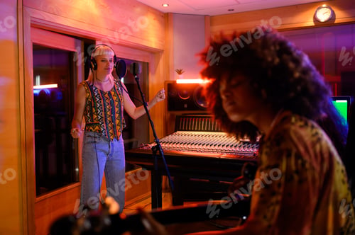 Preview: Talented female singer singing a song at recording music studio.