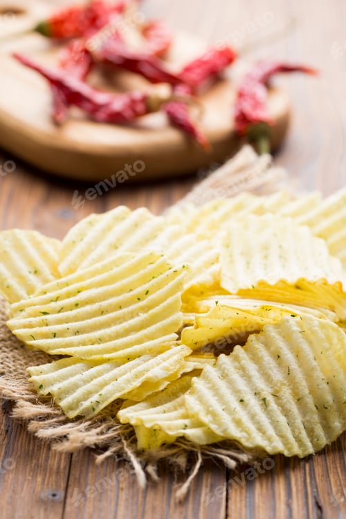 Preview: Eco potato chips on a wooden background. Studio photo.